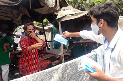 awareness and distribution of Masks at slum area by NSS volunteers on 24th March 21